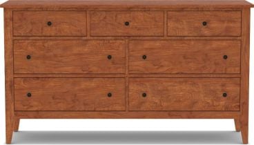 A handcrafted solid cherry wood dresser with seven dovetail-joined drawers, designed for durability and timeless elegance.