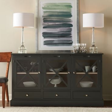 Handcrafted painted wooden buffet with three glass doors shown in black, classic X-style detailing, and spacious interior shelving for stylish and functional storage.
