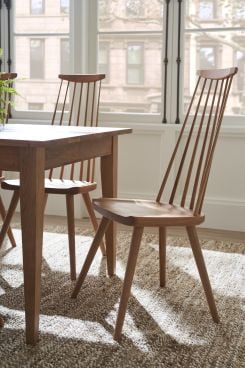 real wood chair at the end of a real wood table