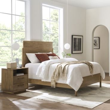 Solid wood bed paired with a matching  wooden nightstand, showcasing clean lines and solid craftsmanship for a contemporary bedroom setting.