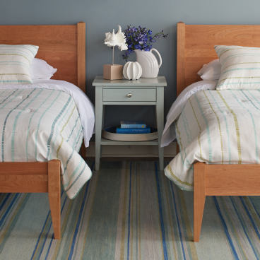 real wood nightstand in guest room