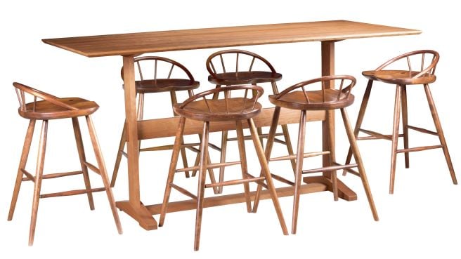 Pub-height table set with spindle-back chairs, crafted in solid wood for a modern yet rustic dining or bar seating experience.