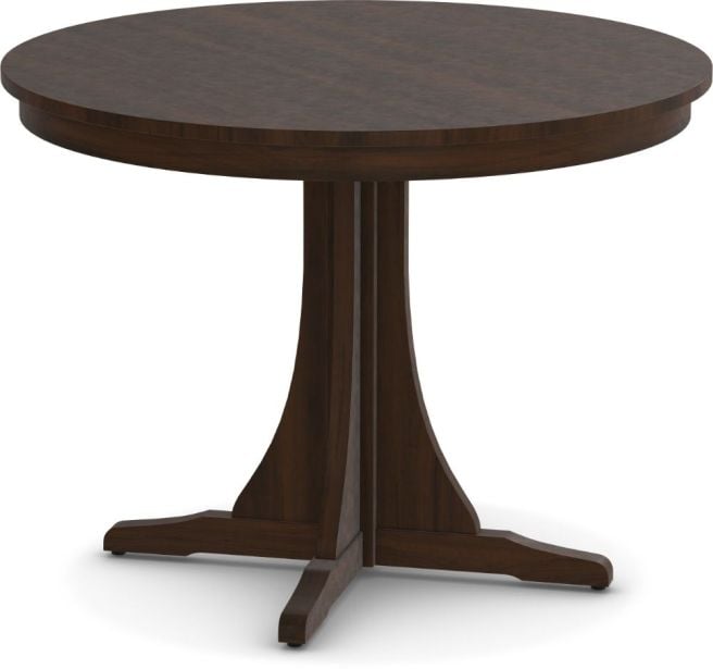 A solid wood round dining table with a pedestal base, crafted in a warm natural finish, showcasing elegant curves and timeless craftsmanship.