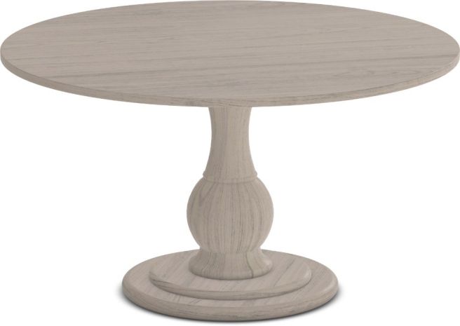 Round wooden pedestal dining table with a classic turned base, finished in a soft neutral tone.