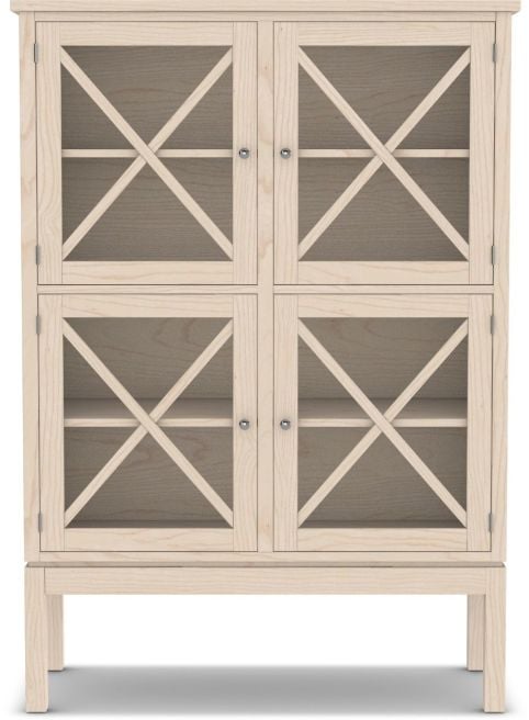 A tall white wooden hutch with glass-paneled doors featuring an elegant X-shaped design, perfect for displaying and storing dining essentials.