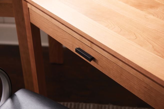zoomed in photo showing the real wood drawer of a handcrafted desk