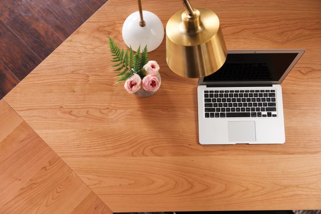 top-down view of the surface of a real wood desk