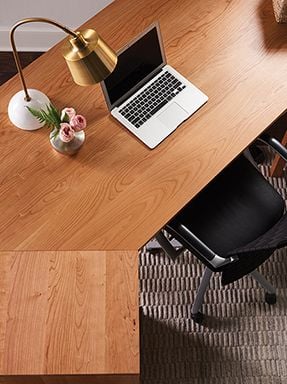 top-down view of real wood corner desk