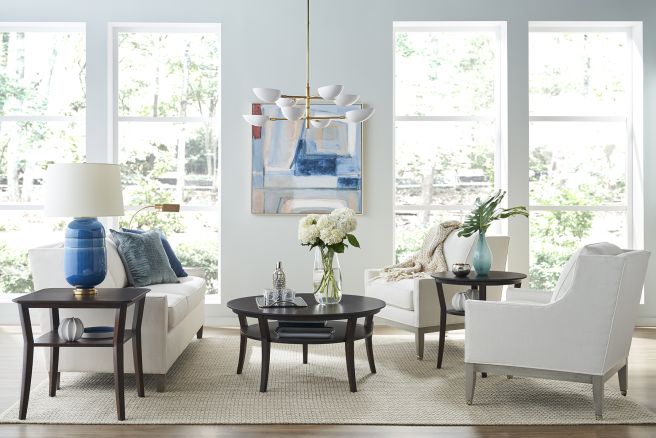 Sophisticated living room with beautifully crafted wood coffee and side tables, blending seamlessly with modern décor.