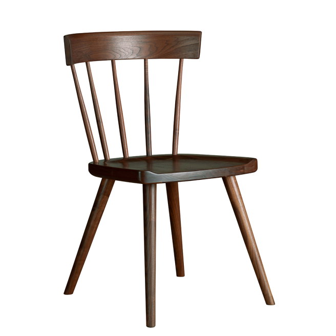 Sleek wooden dining chair with a curved backrest and tapered legs, showcasing a minimalist and timeless design.