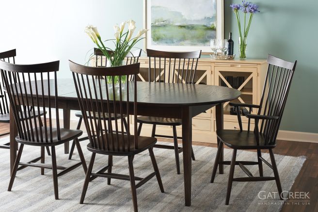 Classic solid wood dining set featuring a spacious table with spindle-back chairs, ideal for traditional and modern interiors.