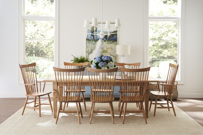 Dining room showcasing a sturdy wooden table and chair set, highlighting the craftsmanship and natural wood grain.
