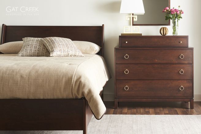 Appalachian Hardwood four drawer dresser places next to a solid wood bed