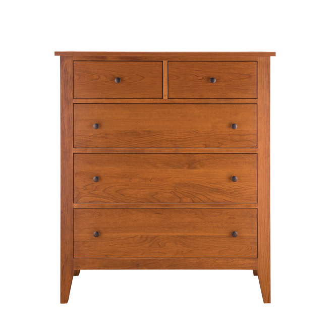 A handcrafted solid cherry wood chest with five dovetail-joined drawers, designed for heirloom-quality bedroom storage.