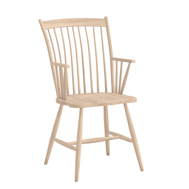 A handcrafted solid wood armchair featuring a classic spindle back and contoured seat in a light natural finish.